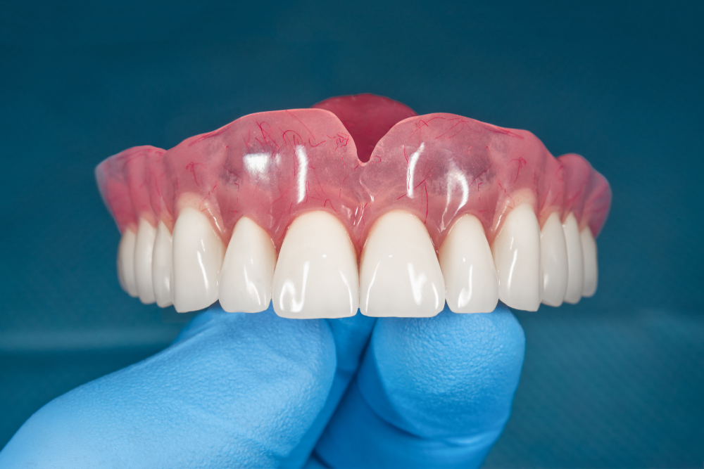 Promotional flyer for Snap-On (Snap-In) Dentures by Pelican Dental Care in Vero Beach, Florida. Includes pricing for one arch and both arches, with membership-exclusive rates and comprehensive package details.